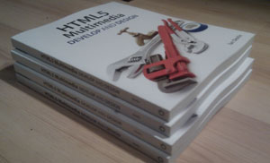 HTML5 Multimedia Develop and Design book pile